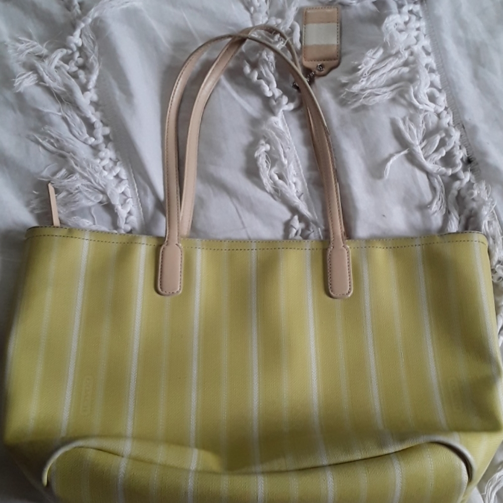 Yellow and white striped coach purse